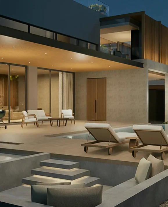 Illuminated house exterior and pool terrace at dusk