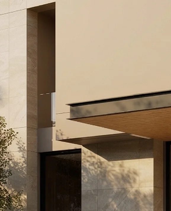 Sunlit exterior wall with soft shadows falling across the paint finish