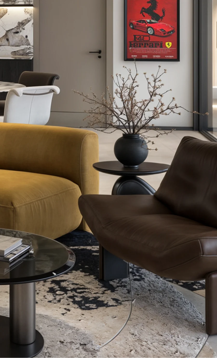Living room with an ochre armchair, dark leather lounge chair and framed artwork