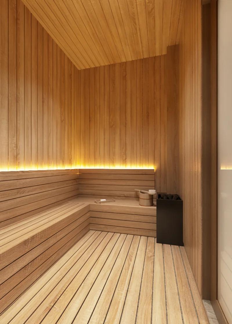 Sauna lined with light timber slats and a corner bench